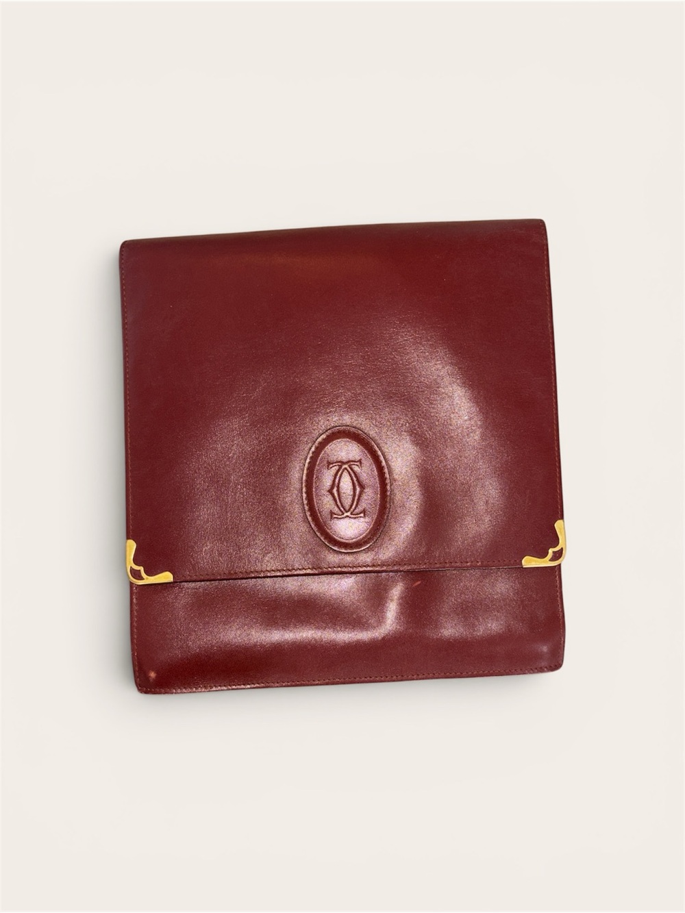 Cartier Deep Burgundy Leather Fold-Top Bag with Gold Corner Details